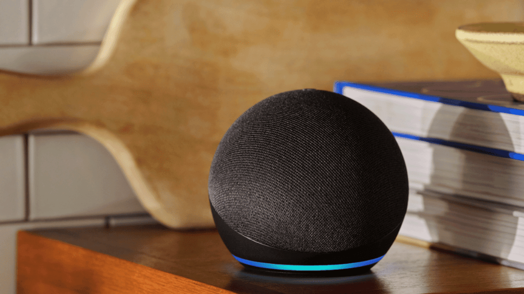 Photo of an Amazon Echo Dot on a wooden kitchen counter.